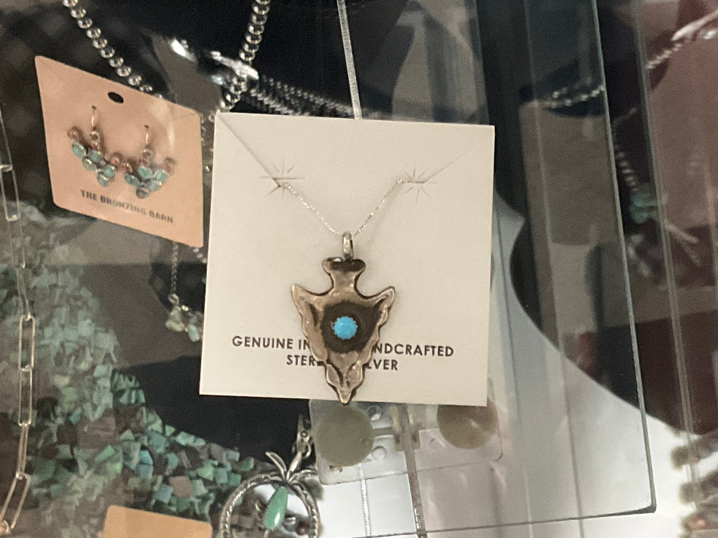 Arrow head w/ turquoise stone
